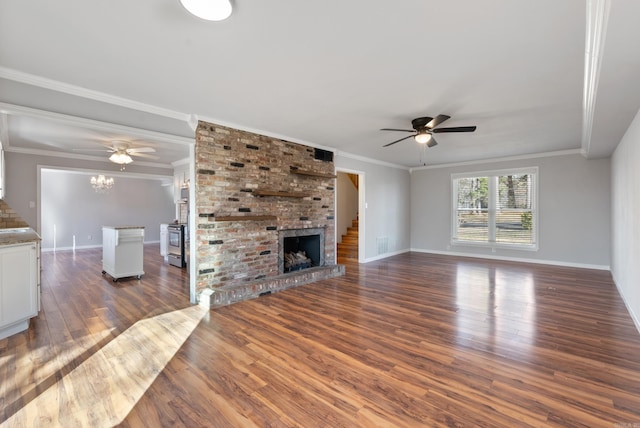 unfurnished living room with ornamental molding, dark wood-style flooring, a fireplace, and baseboards