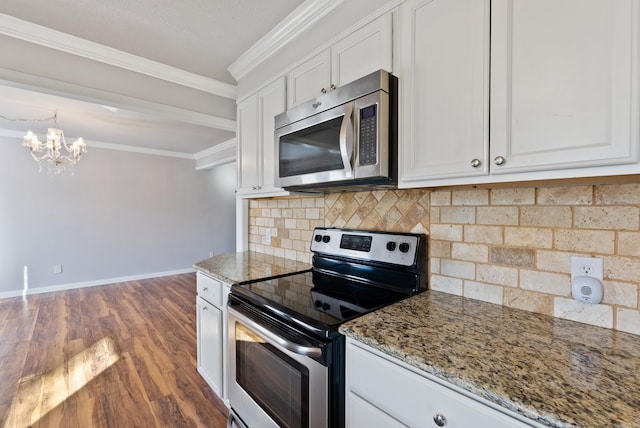 kitchen with appliances with stainless steel finishes, light stone counters, dark wood-style flooring, crown molding, and white cabinetry