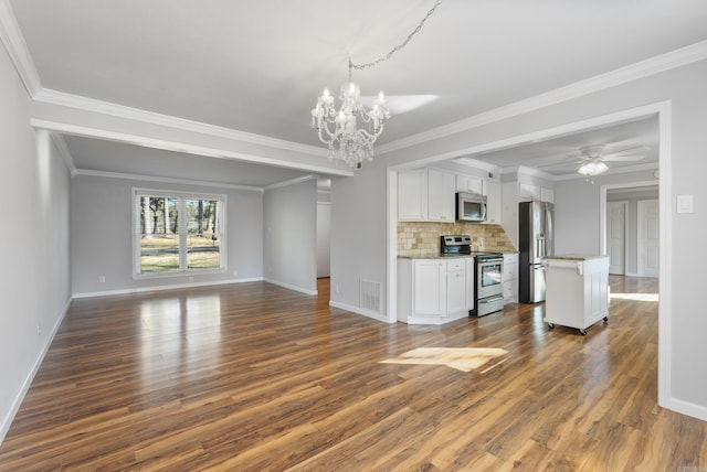 unfurnished living room featuring dark wood-style floors, baseboards, visible vents, and ceiling fan with notable chandelier