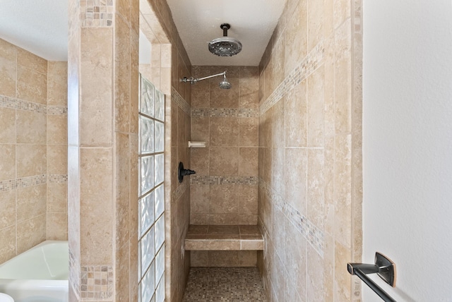 full bath featuring a bathtub and tiled shower