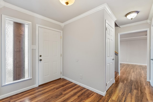 foyer entrance with baseboards, dark wood-style flooring, and crown molding