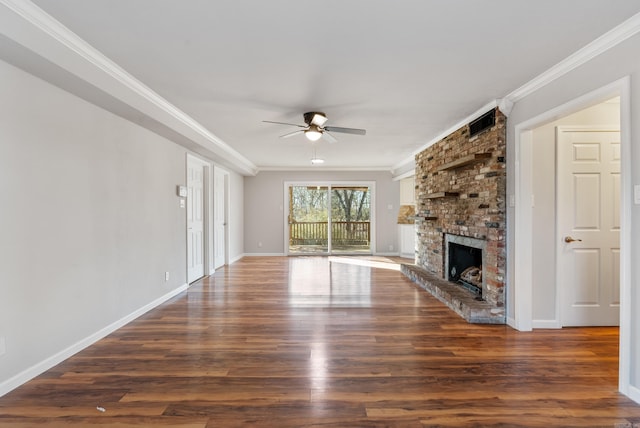 unfurnished living room with ornamental molding, a fireplace, dark wood finished floors, and visible vents