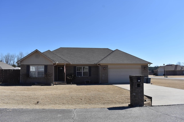 ranch-style home featuring a garage, brick siding, driveway, and a shingled roof