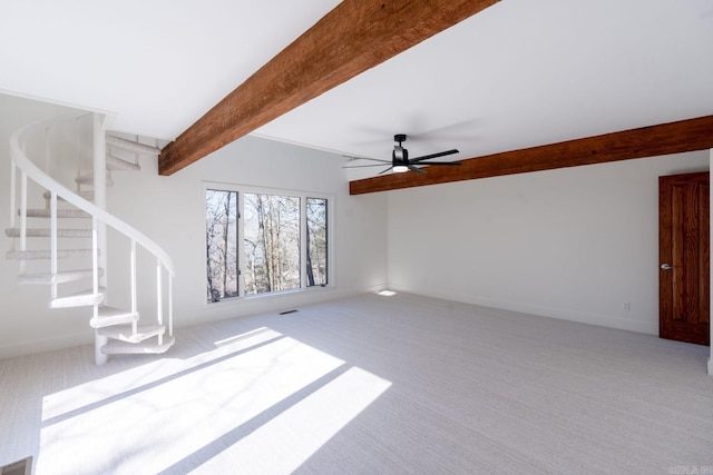 unfurnished living room with light carpet, baseboards, stairway, and beam ceiling