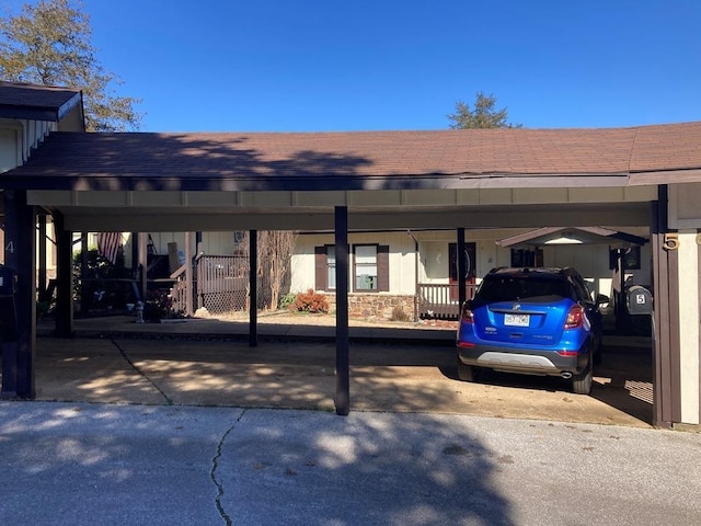 view of parking / parking lot with an attached carport