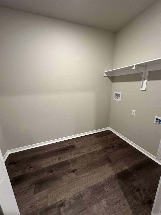 clothes washing area with laundry area, washer hookup, dark wood-type flooring, and baseboards