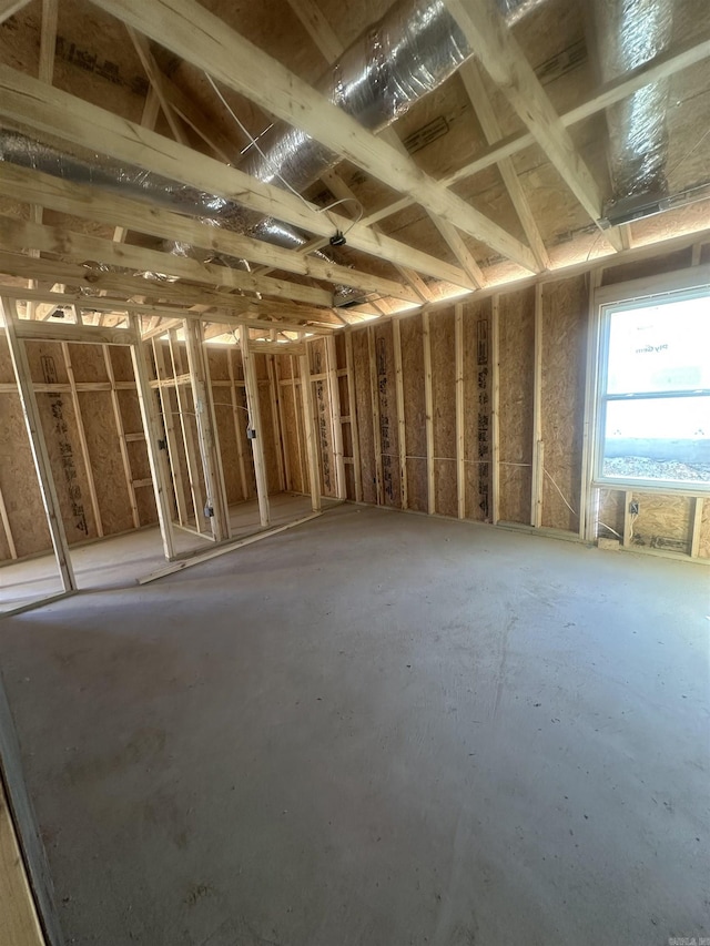 misc room with heating fuel and a garage
