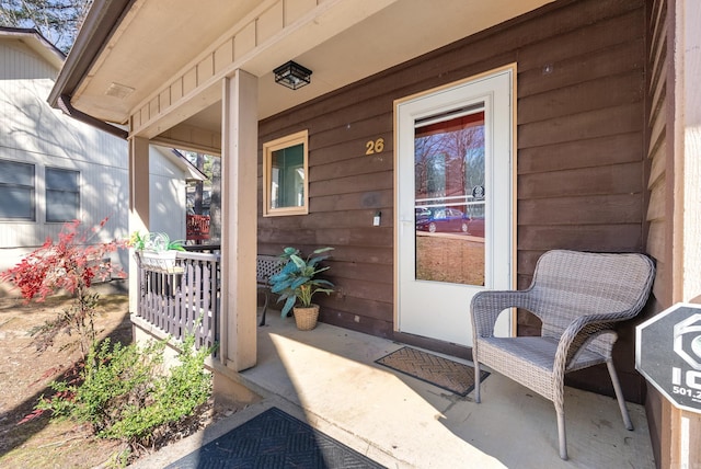 view of exterior entry with covered porch