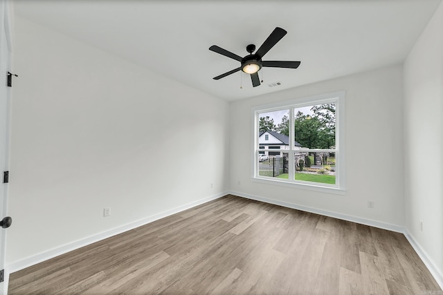 47 Wellington Pl, Cabot, AR 72023 - empty room with wood finished floors, ceiling fan, and baseboards