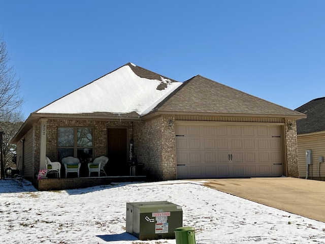 view of front facade featuring concrete driveway and an attached garage