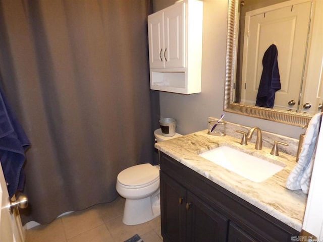 full bathroom with toilet, tile patterned flooring, and vanity