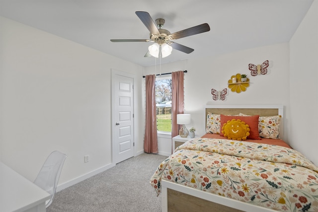 bedroom with ceiling fan, baseboards, and carpet floors