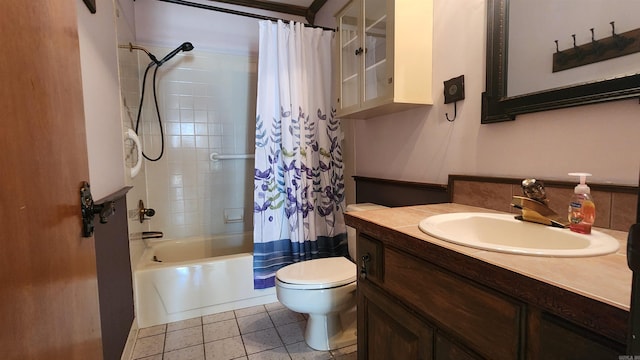 bathroom featuring vanity, tile patterned floors, toilet, and shower / tub combo with curtain