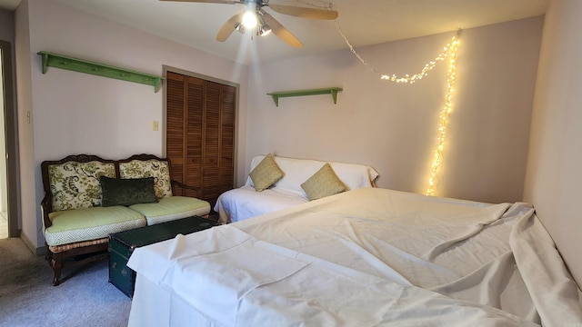 carpeted bedroom featuring ceiling fan and a closet