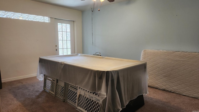 carpeted bedroom featuring ceiling fan and baseboards