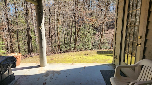 view of patio with a wooded view