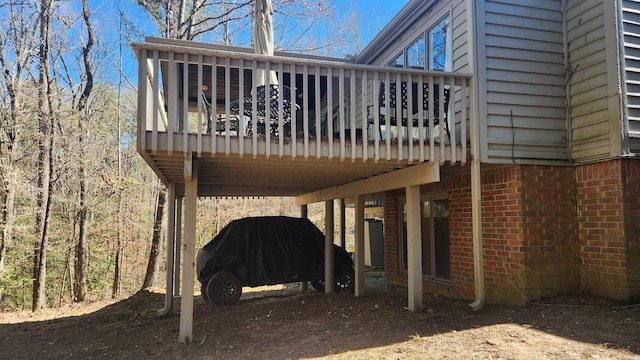 back of house featuring brick siding