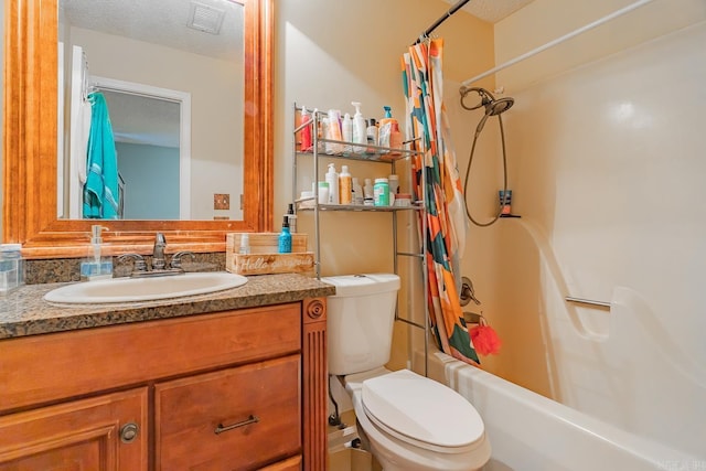 bathroom featuring a textured ceiling, toilet, vanity, visible vents, and shower / bath combo