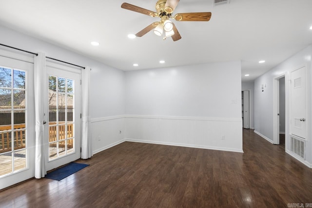 spare room with a wainscoted wall, dark wood-style floors, a ceiling fan, and recessed lighting