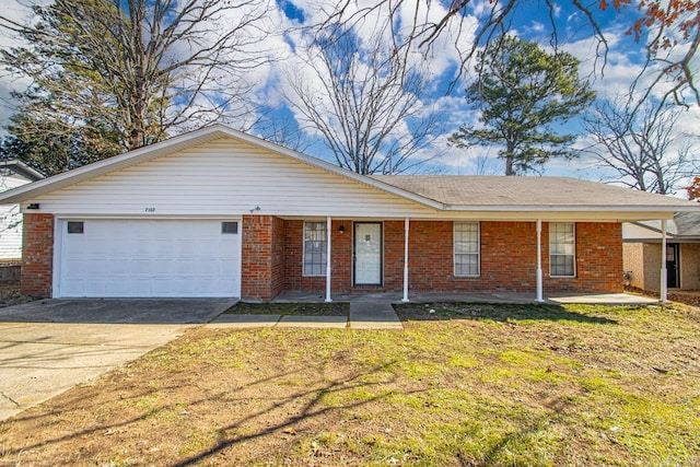 ranch-style home featuring a garage, driveway, and brick siding