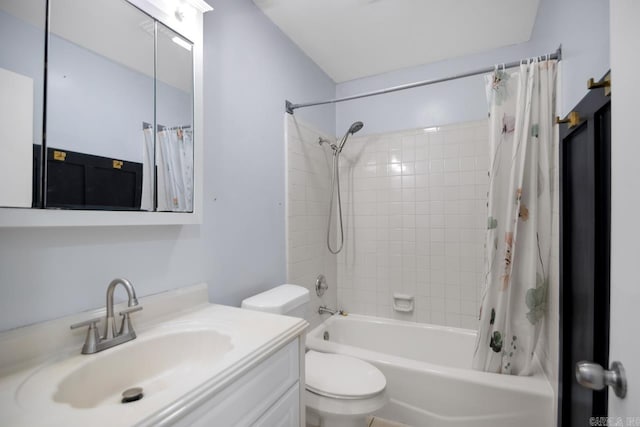 bathroom featuring toilet, shower / tub combo with curtain, and vanity