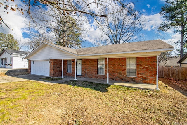 ranch-style home with concrete driveway, brick siding, an attached garage, and fence