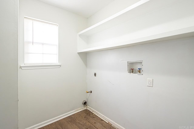 clothes washing area with dark wood-style floors, hookup for a washing machine, hookup for a gas dryer, laundry area, and baseboards