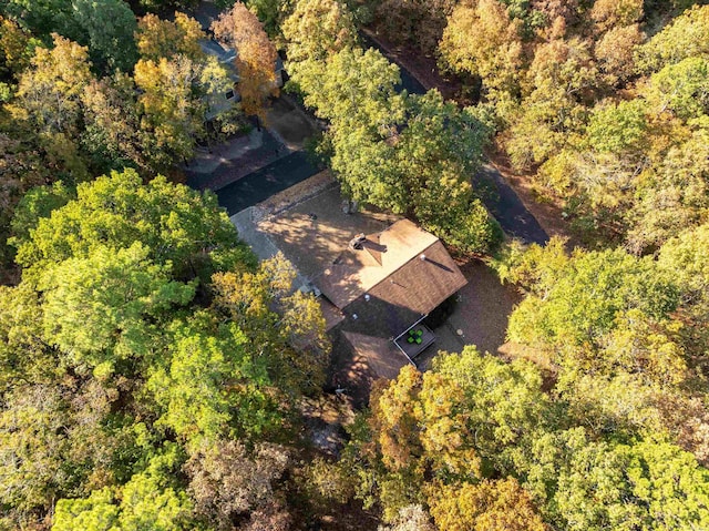 birds eye view of property with a view of trees