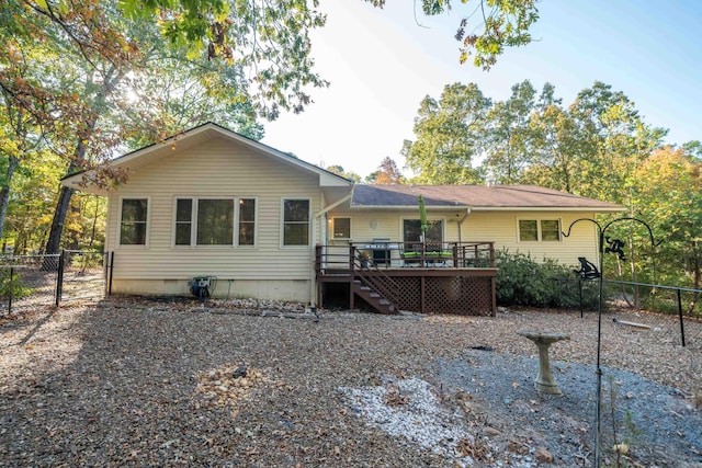 view of front of home with crawl space, stairway, fence, and a wooden deck