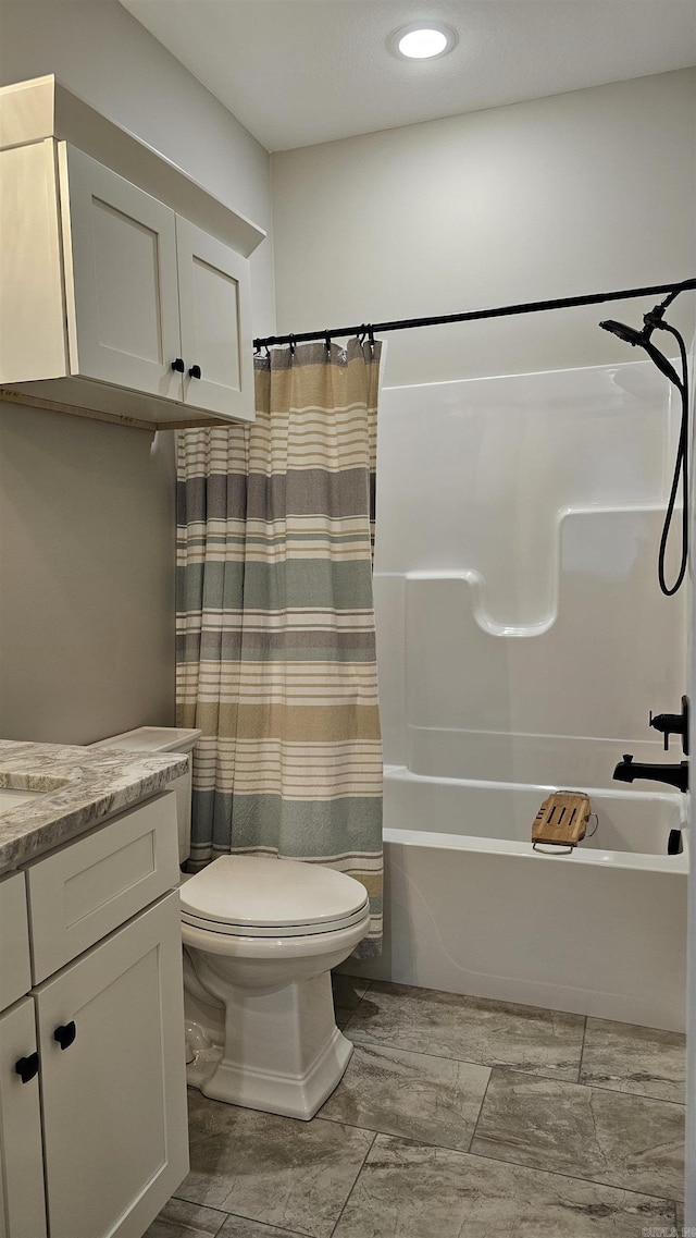 bathroom featuring toilet, shower / bathtub combination with curtain, and vanity