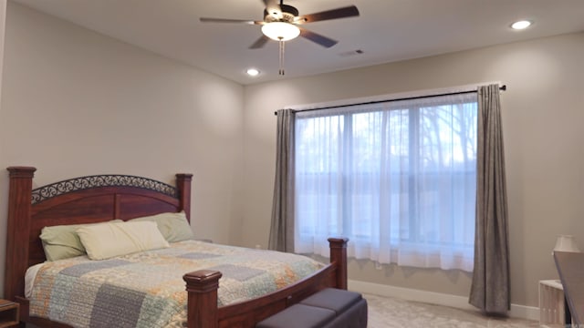 bedroom featuring visible vents, baseboards, light colored carpet, ceiling fan, and recessed lighting