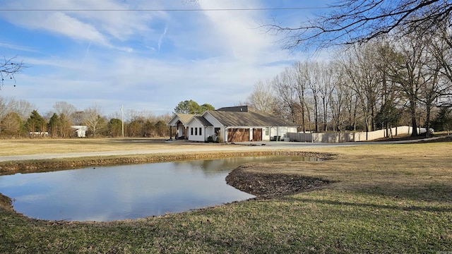 exterior space with fence and a front lawn