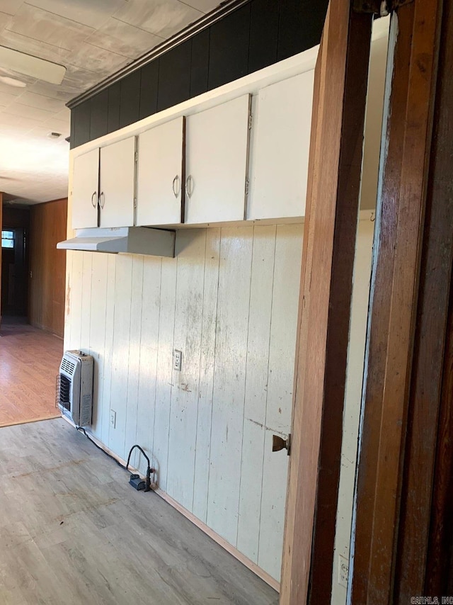 860 Ash St, Prescott, AR 71857 - interior space featuring wood walls, wood finished floors, and heating unit