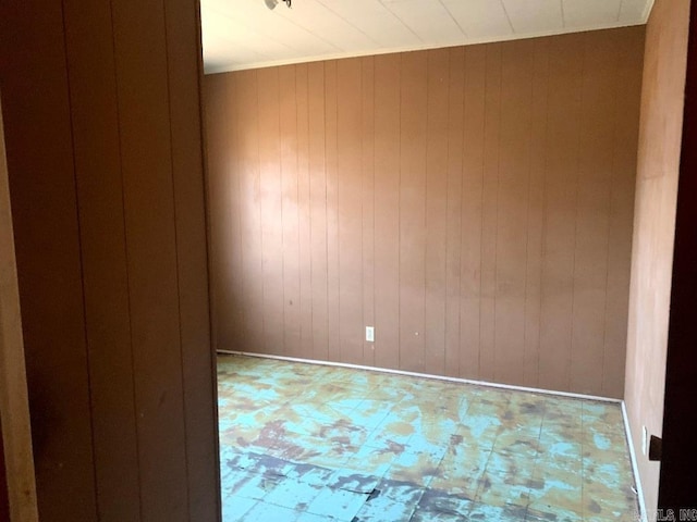 860 Ash St, Prescott, AR 71857 - empty room with wooden walls and tile patterned floors