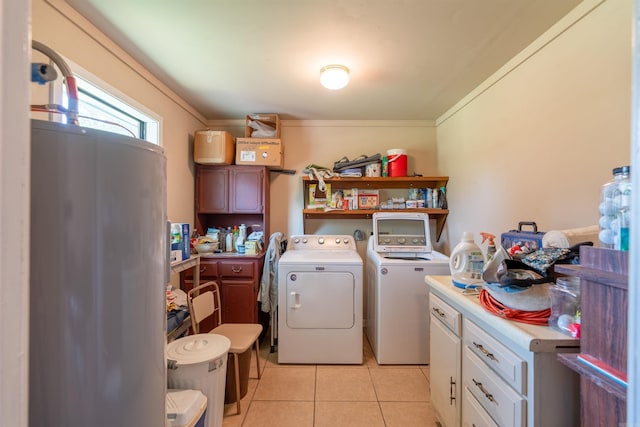 laundry room featuring laundry area, light tile patterned flooring, and washing machine and clothes dryer