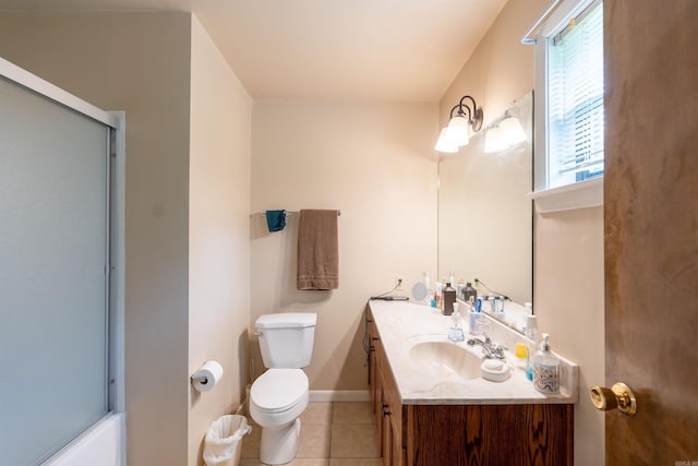 bathroom with baseboards, toilet, tile patterned flooring, combined bath / shower with glass door, and vanity