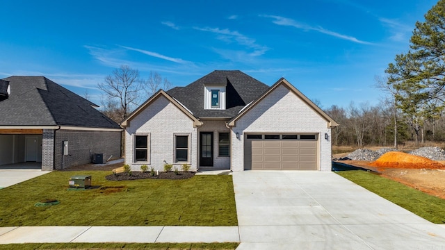 view of front of property featuring an attached garage, central AC, brick siding, driveway, and a front lawn