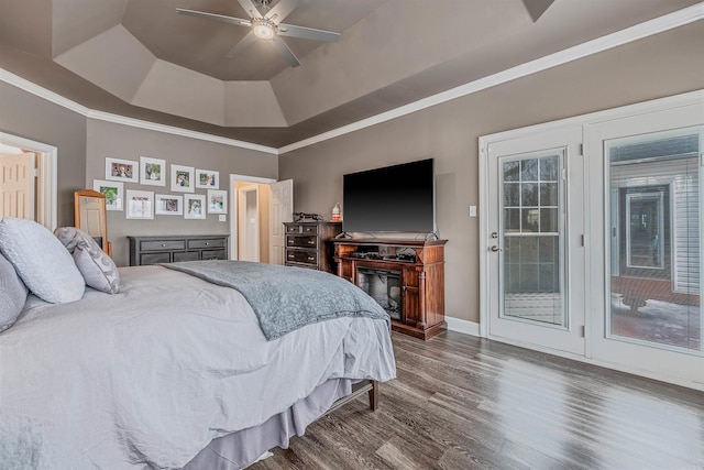 bedroom featuring dark wood-style floors, a raised ceiling, a ceiling fan, access to outside, and baseboards