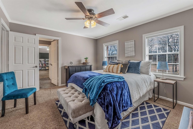 bedroom with baseboards, visible vents, a ceiling fan, crown molding, and carpet floors