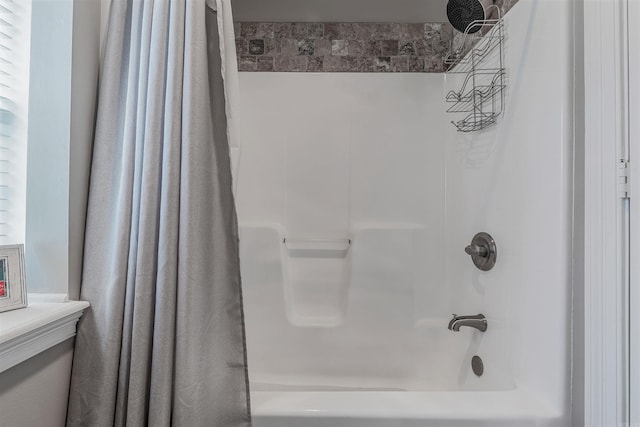 bathroom featuring shower / bathtub combination with curtain