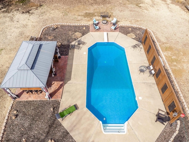 view of pool featuring a fenced backyard and a gazebo