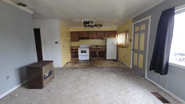 kitchen with ornamental molding, white appliances, visible vents, and under cabinet range hood