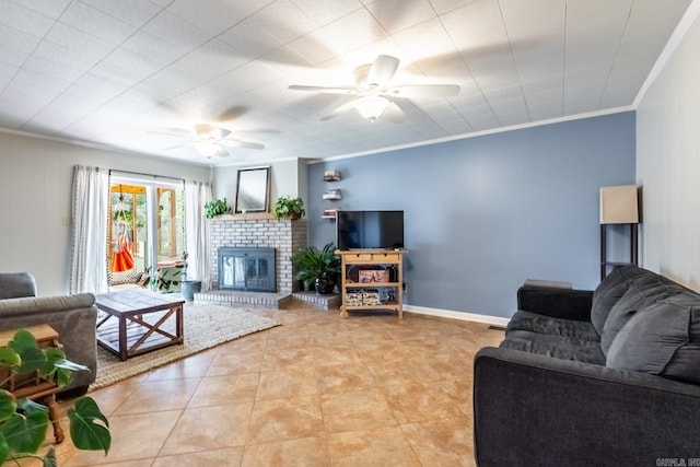 living room with light tile patterned floors, a fireplace, a ceiling fan, and crown molding