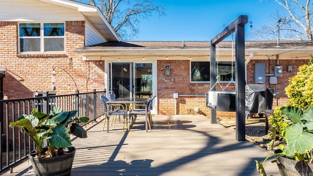 deck with outdoor dining area