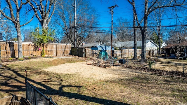 view of yard with a fenced backyard