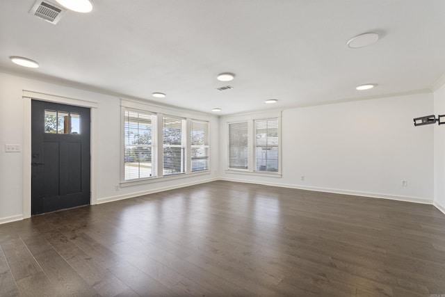 entrance foyer featuring dark wood-style flooring, visible vents, plenty of natural light, and baseboards