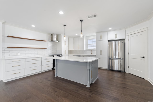 kitchen featuring stainless steel appliances, open shelves, light countertops, and white cabinetry