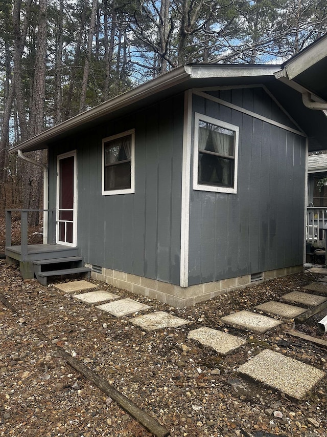 view of side of property featuring crawl space