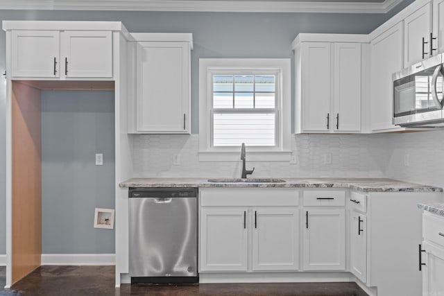 kitchen featuring white cabinetry, stainless steel appliances, and a sink