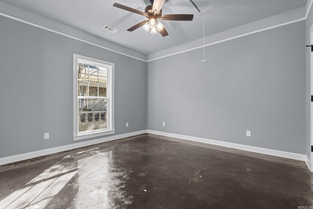 empty room with ceiling fan, concrete flooring, visible vents, baseboards, and attic access